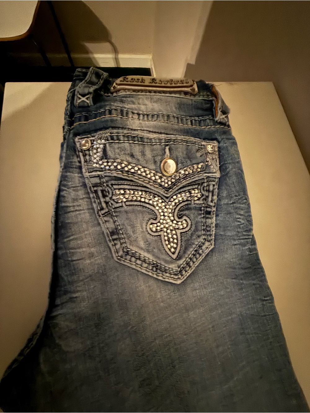 Rock Revival Women's Distressed Blue Boot Cut Jeans with Rhinestone Back Pocket
